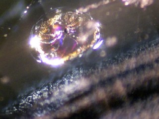 Cut sapphire with zircon crystal